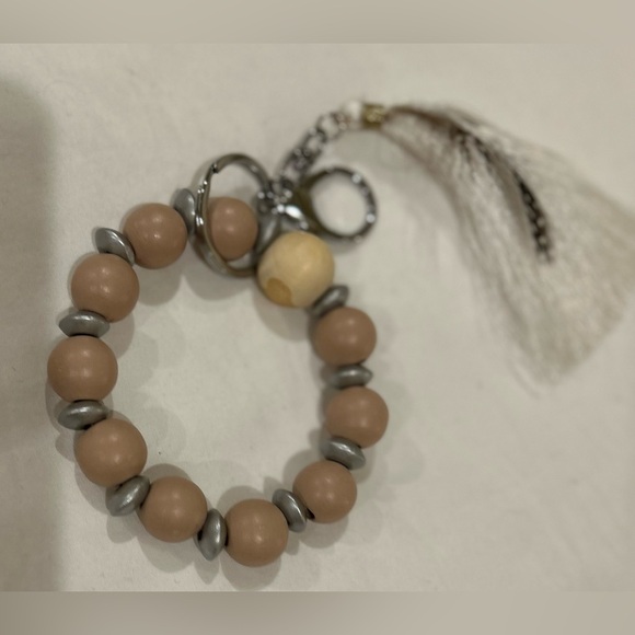 Natural Wood Beads with a tassel and feather - Picture 1 of 3
